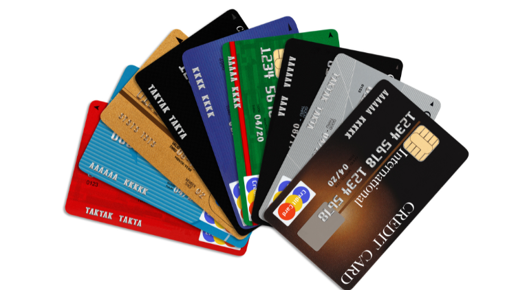 A fanned-out selection of colorful credit cards in various designs displayed on a clean white background.