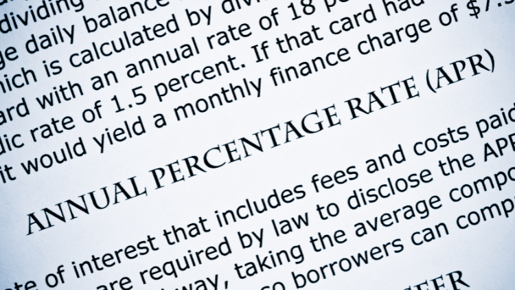 Close-up text highlighting the definition of annual percentage rate (APR), explaining finance charges and credit costs.