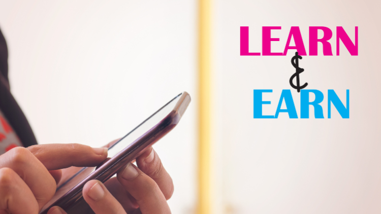 Close-up of a person using a smartphone beside bold text that says "Learn & Earn."